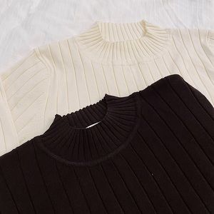 Turtle necks in black and cream. H&M